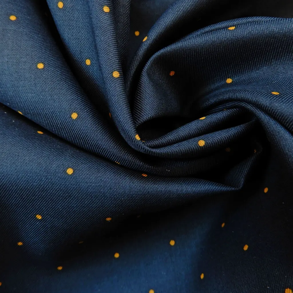 tissu-dormant-coton-bleu-fonce-a-pois-1.webp
