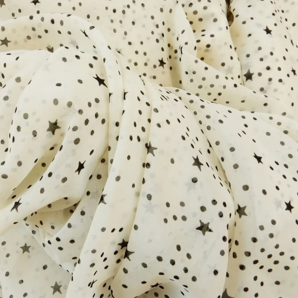 mousseline-ecrue-petites-etoiles-noires-tissu-dormant-2.webp