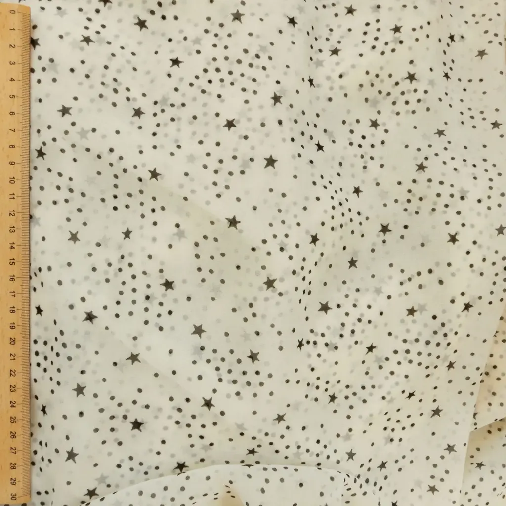 mousseline-ecrue-petites-etoiles-noires-tissu-dormant-3.webp