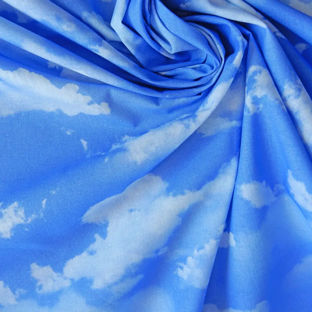 CIEL-tissu-coton-imprimé-nuages-blancs-sur-fond-bleu-1c.webp