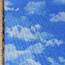 CIEL-tissu-coton-imprimé-nuages-blancs-sur-fond-bleu-2.webp