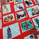 Popeline de coton Timbres du Lumeçon sur fond rouge